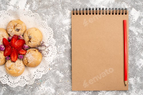 Preview: top view delicious sugar cookies from sand dough with strawberries on a white background fruit