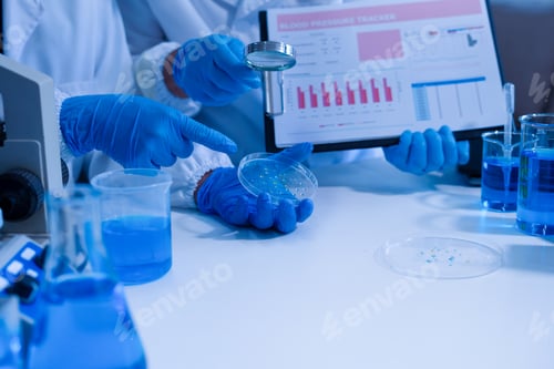Preview: Lab work, Doctor holds a test tube takes the test from a test tube in analysis.