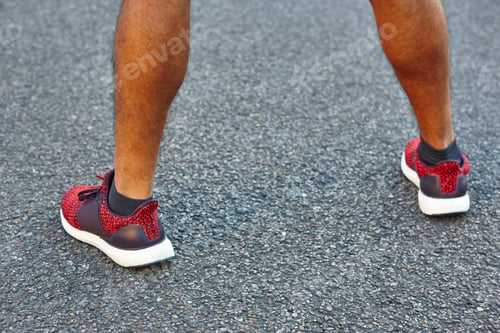 Preview: Athlete runner and sneakers on the asphalt ready to run