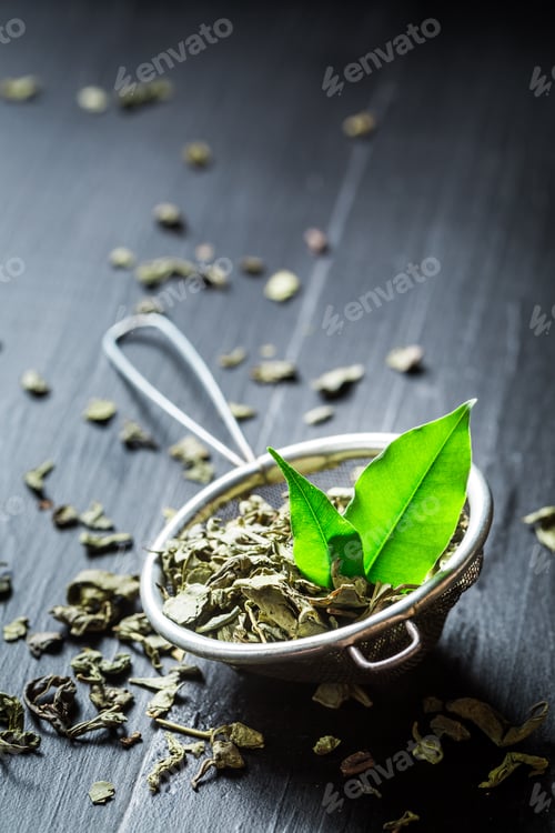 Preview: Delicious green tea in old metal strainer