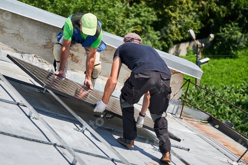 Preview: Workers building solar panel system on roof of house. Installers carrying photovoltaic solar module