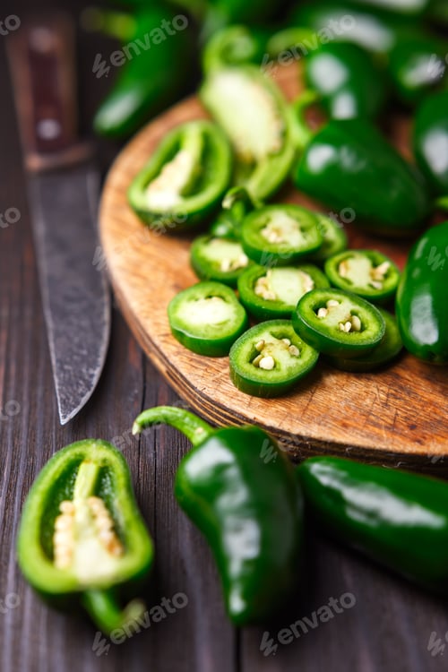 Preview: Whole, half and sliced green jalapeno hot peppers