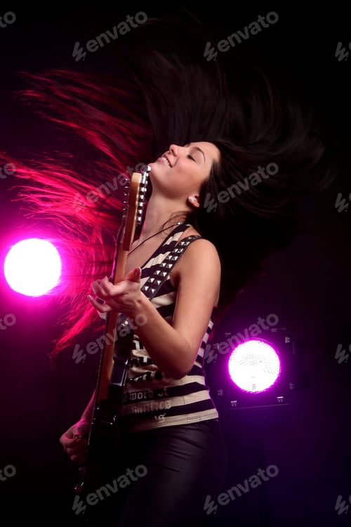 Preview: happy smiling girl playing guitar