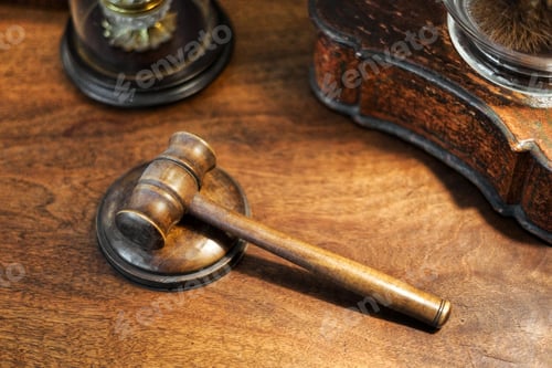Preview: Small wooden judges gavel on a desk in a high angle view