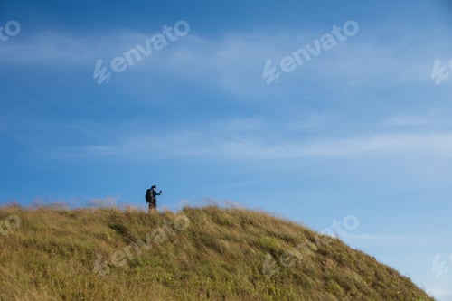Preview: alone hiking man see view on mountain