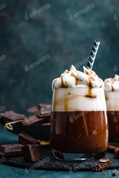 Preview: Hot chocolate with whipped cream. Chocolate dessert drink in glass