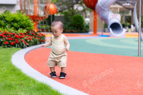 Preview: Little baby enjoying outdoor playtime in sunny park