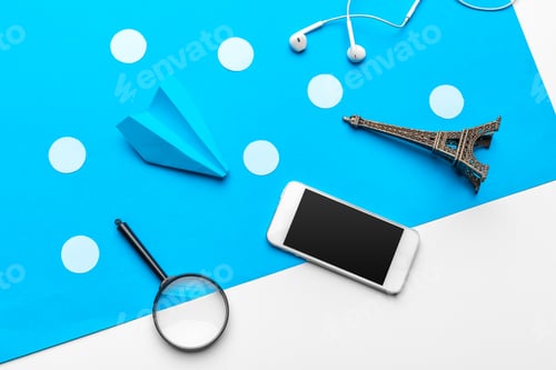 Preview: paper plane with office supplies on blue background