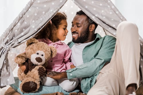 Preview: african american man looking at daughter in wigwam