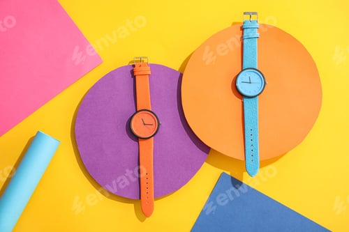 Preview: Composition with stylish wrist watches on color background, flat lay. Fashion accessory