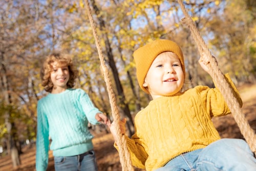 Preview: Happy children having fun outdoor in autumn park