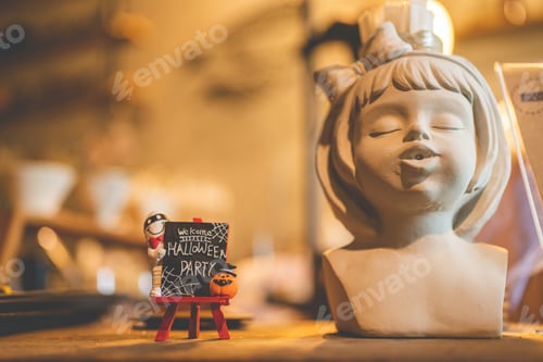 Preview: Halloween party concept decorate in cafe, decoration with human skull and pumpkin in holiday