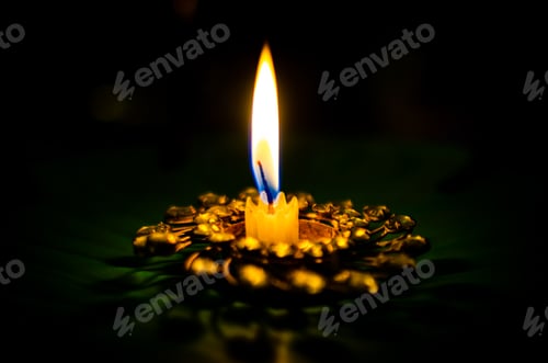 Preview: a candle in the darkness with one light on top of it