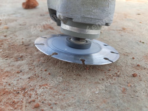 Preview: Closeup shot of a stone cutting blade on rocky surface