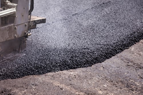 Preview: City Street Revitalization Through Asphalt Paving Process Under Bright Sunlight