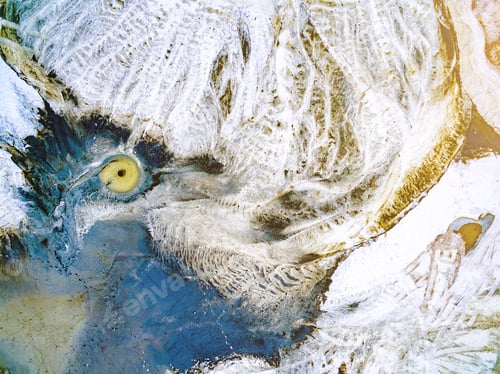 Preview: abstract patterns on the ground from water streams