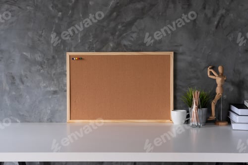 Preview: White working space with Cork board and cup, office supplies and book in home office workplace