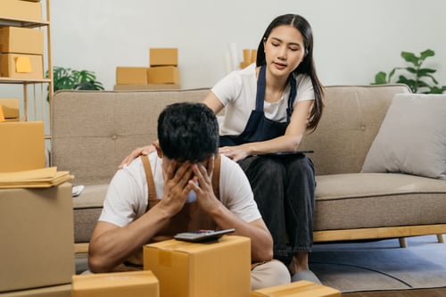 small online business owner Stressed couple having headache with lost parcel box at home.