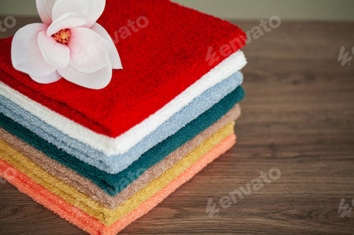 Preview: Stack colorful towels in bathroom on table