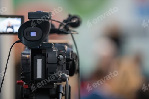 Preview: Behind the scenes, a media camera capturing the captivating moments of a dynamic event.