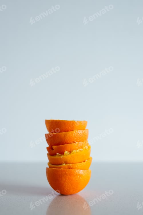 Preview: Pile of freshly squeezed oranges on white background