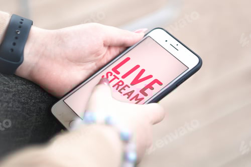 Preview: Live stream - woman holding a mobile phone