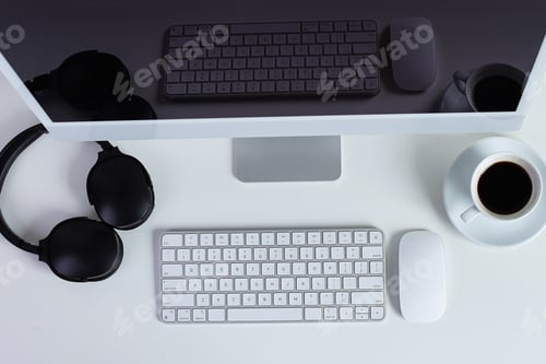 Preview: Modern Minimalist Workspace With Computer, Headphones, Coffee, And Keyboard Setup