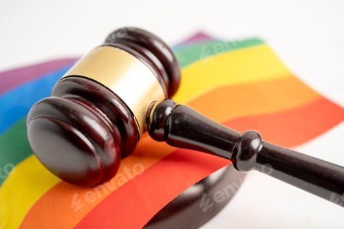 Preview: Gavel for judge lawyer on rainbow flag, symbol of LGBT pride month celebrate annual