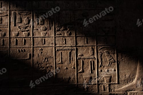 Preview: Closeup shot of stone carvings of Egyptian hieroglyphs in the Karnak Temple Complex, Luxor, Egypt