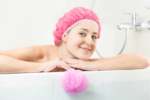 Preview: young woman in shower cap posing in bath
