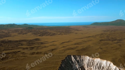 Preview: Aerial view of autumn yellow valley and stony cleft. Clip. Flying above stunning summer hilly region