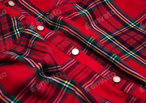 Preview: Close up view of a red plaid shirt