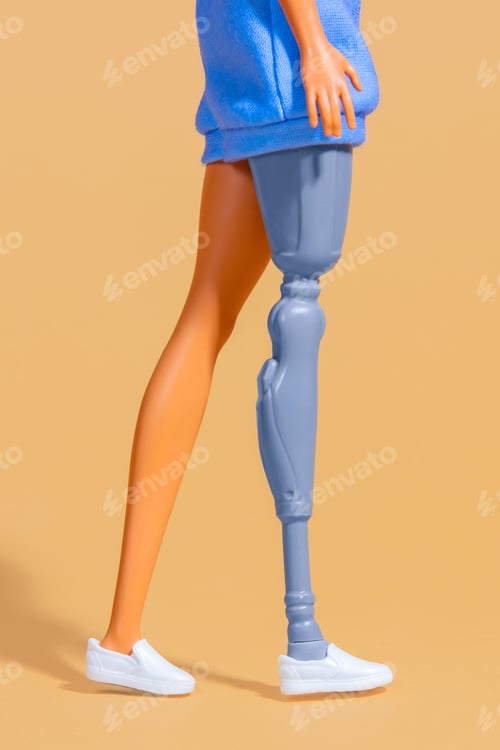 Preview: female doll with a prosthetic leg. Focus on low part of body