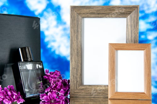 Preview: front view black expensive fragnance with picture frames on the light blue background present