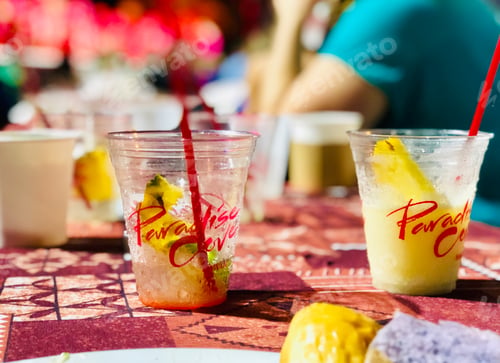 Preview: Empty tropical drinks on table at luau in Hawaii