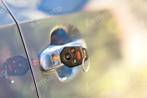 Preview: Close up of car door with key sticking out of the lock. Concept of process opening or closing