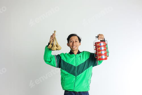 Preview: Asian Male Online Driver Delivering Ketupat and Side Dish on Red Stacked LUnchbox