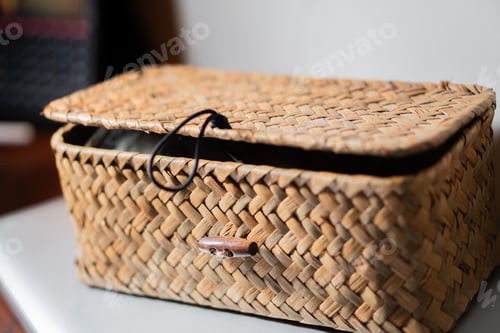 Preview: Woven wicker basket with partially open lid