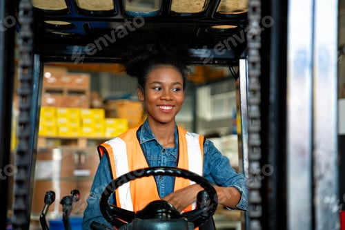 Preview: forklift operator in storage warehouse looking way during transport goods to storage shelf area