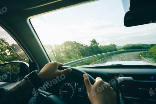 Preview: People driving car on mountain road