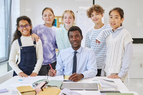 Preview: Diverse Group of Kids with Teacher in School