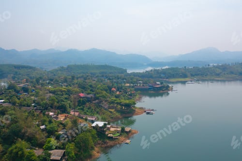 Preview: Aerial top view of houses in Mon village, Kanchanaburi, Thailand in urban city town in Asia