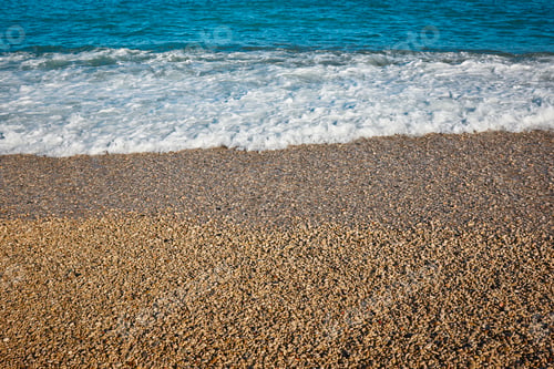 Preview: Mediterranean pebble beach and blue sea in Valencia. Spain