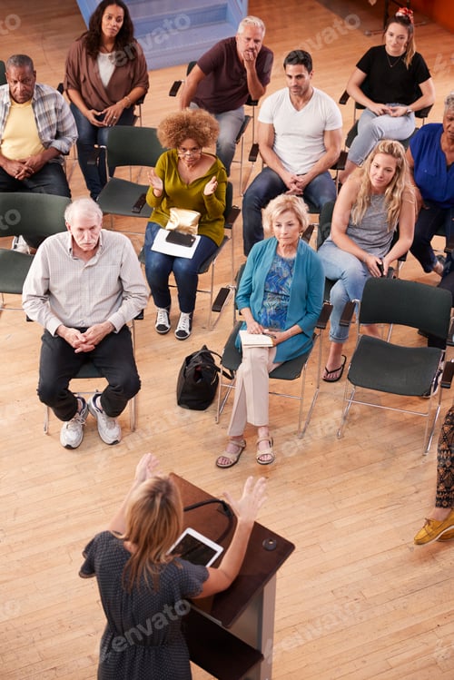 Preview: Overhead View Of Group Attending Neighborhood Meeting In Community Center
