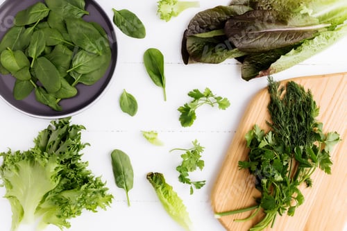Preview: Bowl with salad leaves of spinach, lettuce, romaine, parsley, white background