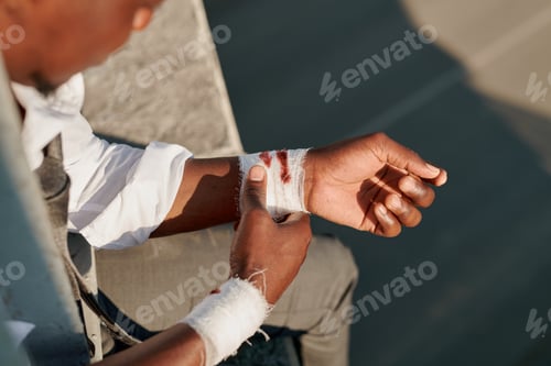 Preview: Depressed man with bandaged wrists