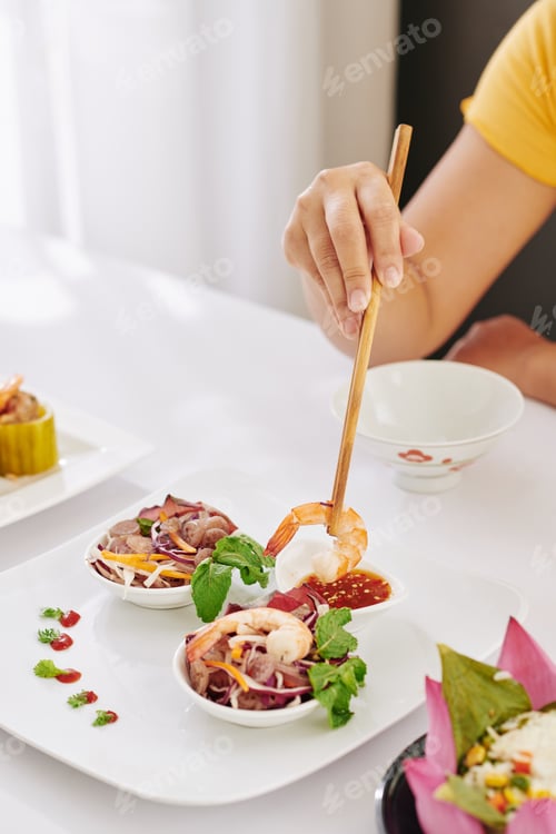 Preview: Woman eating shrimp salad