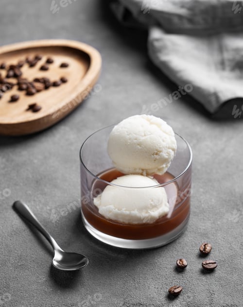 Preview: Affogato coffee with vanilla ice cream scoops and espresso in a glass on a dark background