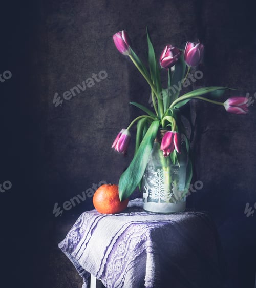 Preview: Bouquet of pink tulips in a vase with orange fruit