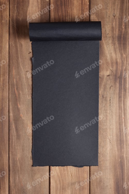 Preview: curved or scrolled paper on wooden background